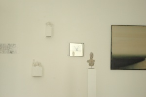 David's work on the wall next to the bust in a gallery in the Marais, July 2012